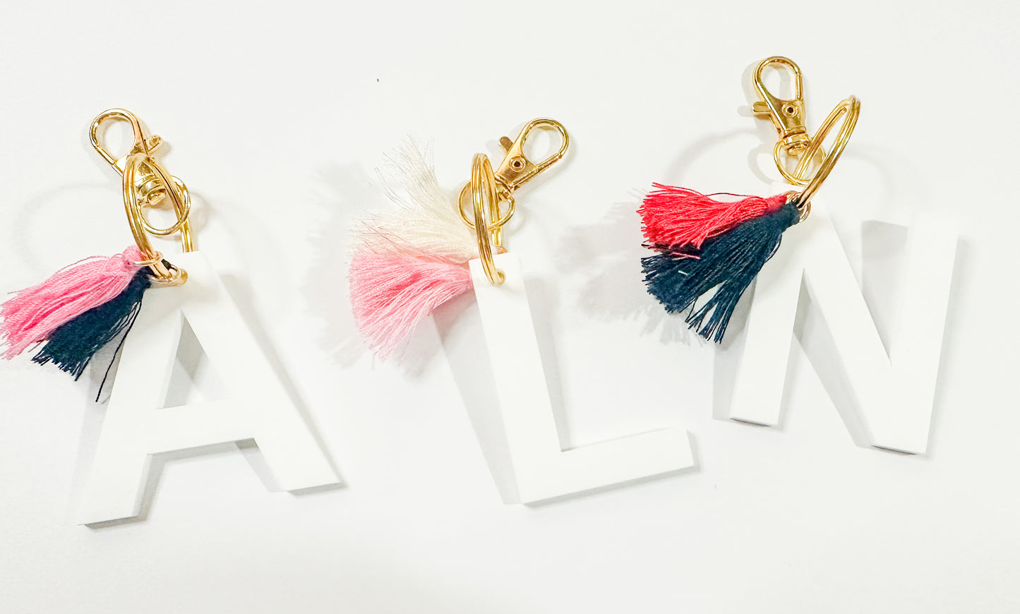 White Letter Keychain with Tassles